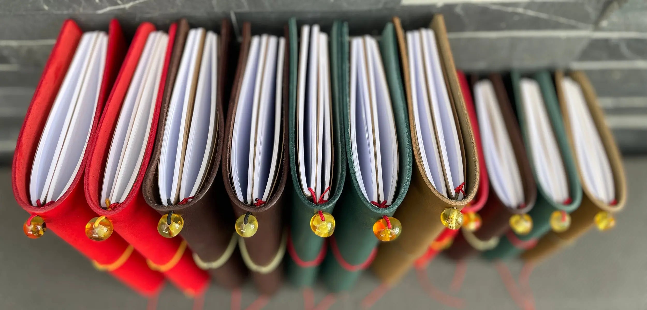Bielinis traveler’s journals in various colors, handmade leather notebooks designed for writing and travel inspiration.