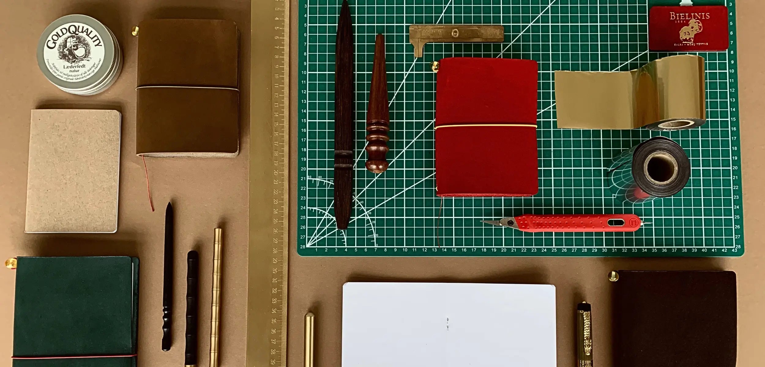 leather-journal-bielinis-with-workbench-tools-and-materials-cover.webp