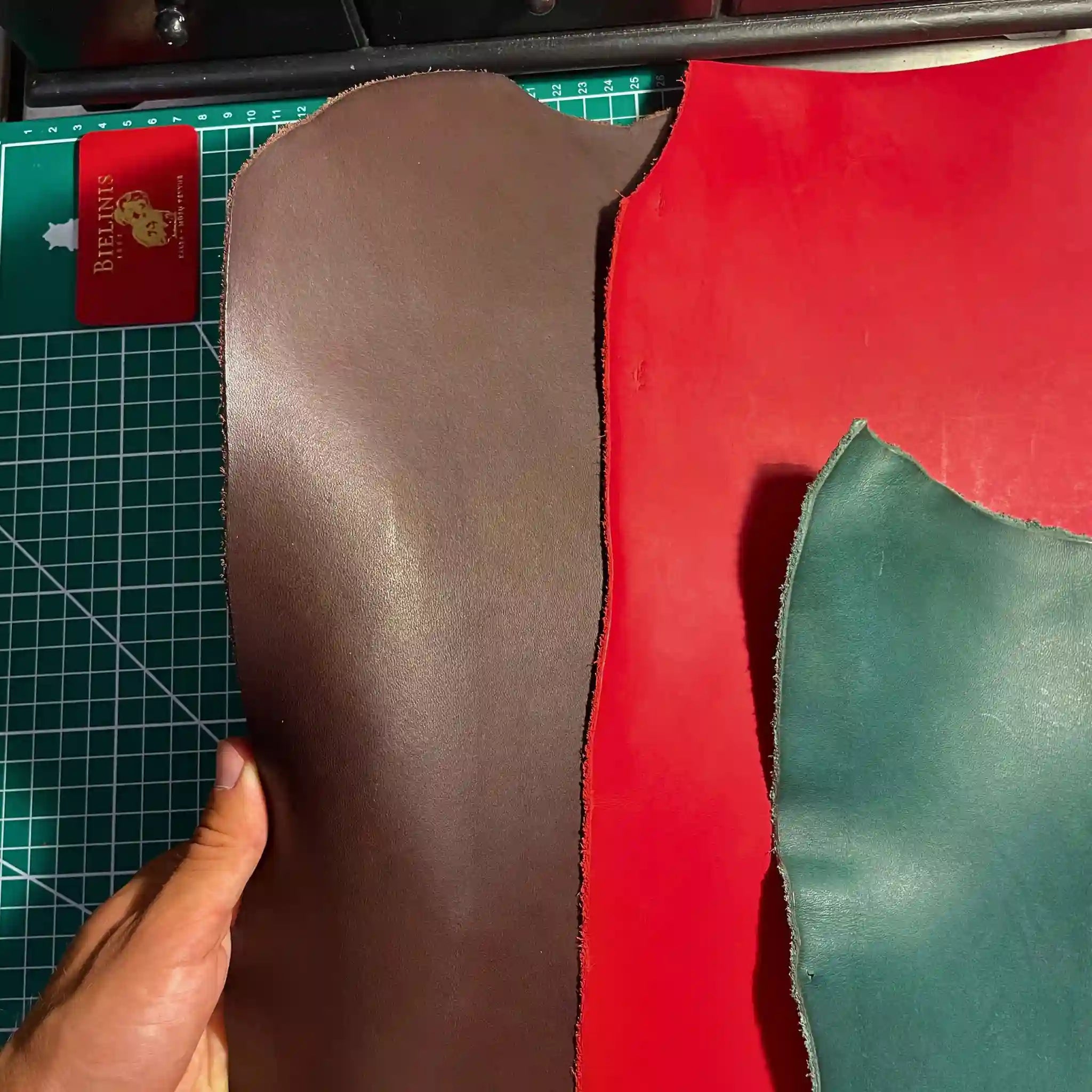 Selection of premium Italian vegetable-tanned leathers in various shades, showcasing the quality materials used in Bielinis traveler’s journals.