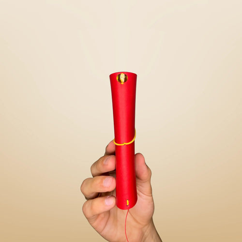 Bielinis handmade traveler’s leather journal in red color, side view showcasing amber details, craftsmanship and rich texture.