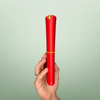 Bielinis handmade traveler’s journal Atlas in vibrant red leather, side view highlighting authentic Baltic amber accents and fine leatherwork.