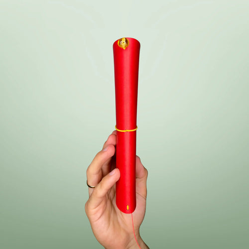 Bielinis handmade traveler’s journal Atlas in vibrant red leather, side view highlighting authentic Baltic amber accents and fine leatherwork.