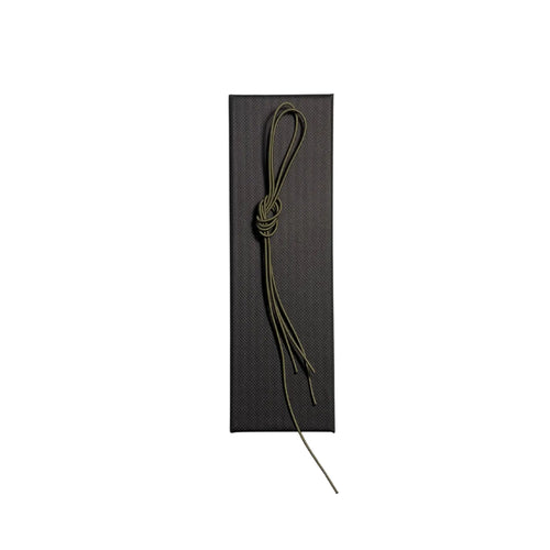 Elastic cord closure for handmade leather traveler’s journal in army green, available in various colors.