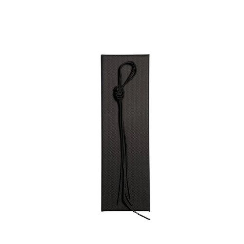 Elastic cord closure for handmade leather traveler’s journal in black, available in various colors.