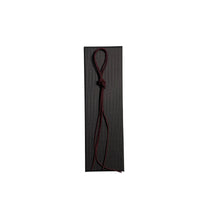 Elastic cord closure for handmade leather traveler’s journal in burgundy, available in various colors.