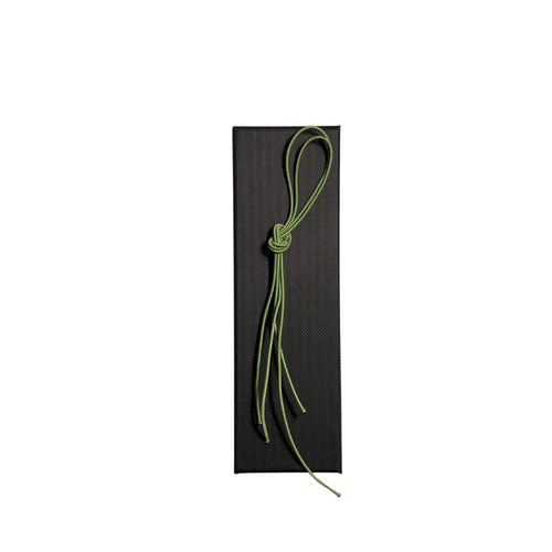 Elastic cord closure for handmade leather traveler’s journal in light green, available in various colors.