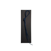 Elastic cord closure for handmade leather traveler’s journal in navy blue, available in various colors.