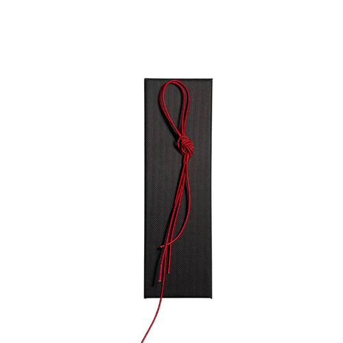 Elastic cord closure for handmade leather traveler’s journal in red, available in various colors.