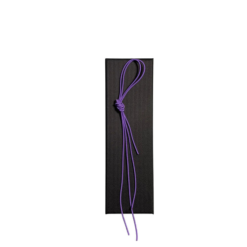 Elastic cord closure for handmade leather traveler’s journal in violet, available in various colors.